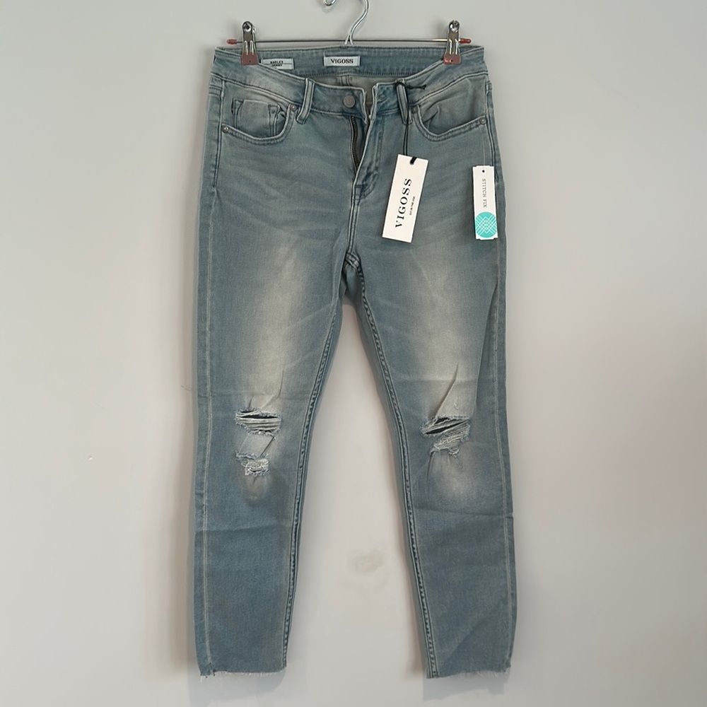 Marley skinny distressed fray hem jean in light blue, mid rise, ankle cut